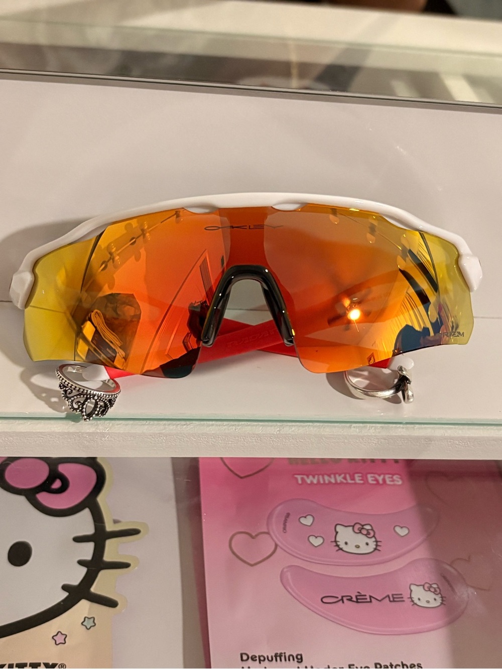 Oakley White Frame Sunglasses with Orange-Red Mirrored Lens